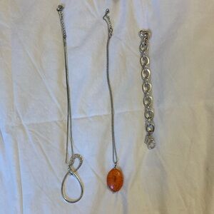 2 necklaces and 1 chain bracelet.